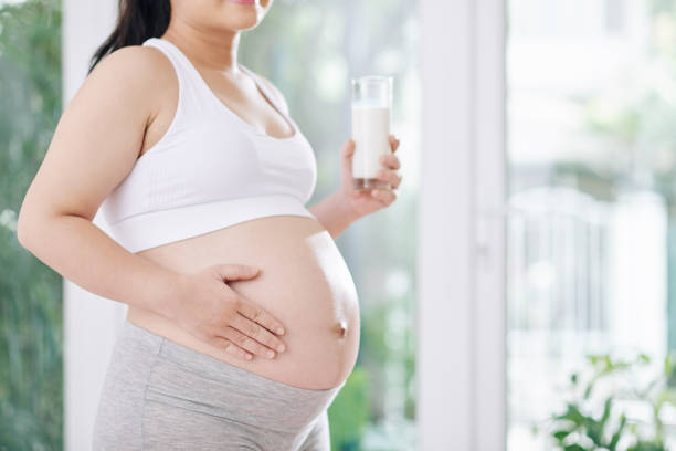 istock Pregnant woman drinking non-dairy milk 1284723404