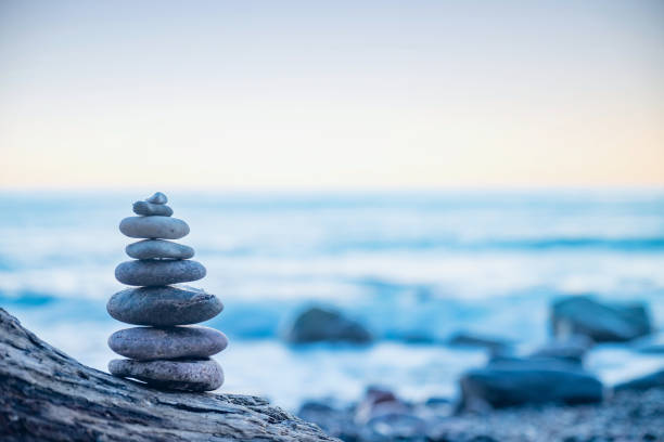 istock Stones pebbles stacked in a Zen pyramid on sea coast 1284723556