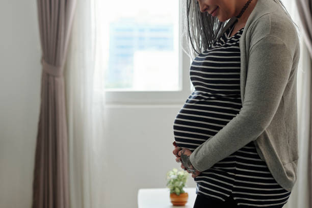 istock Pregnant woman with big belly 1284724949