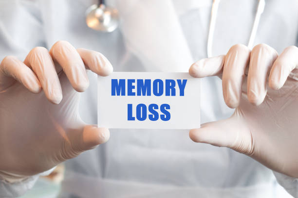 istock Doctor holding a card with text MEMORY LOSS 1284726785
