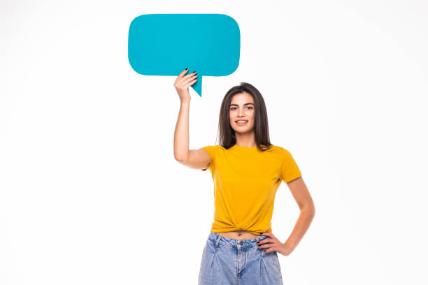 istock Young woman with speech bubble isolated on white background 1284727683