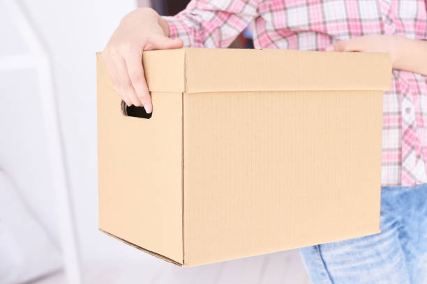 istock Girl preparing to remove with box 1284728469