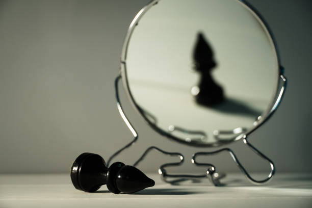 istock A chess piece is reflected in the mirror. Things and people are not what they seem. Reassessment of their abilities. Psychology, motivation. Power of thought. Never give up, always go for your goal. 1284729182