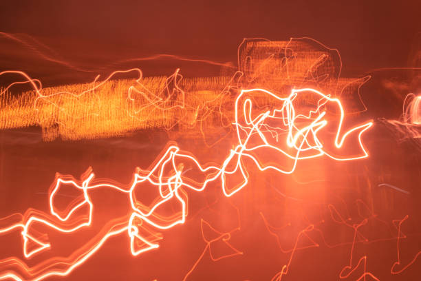 istock Abstract colorful light trails in the dark, motion blur effect 1284729259