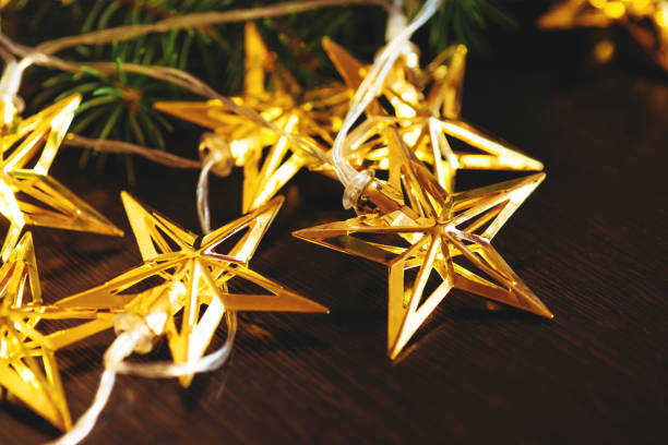 istock Christmas tree branch and garland. 1284729398