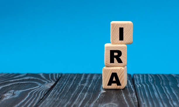istock concept word IRA on wooden cubes on a blue background 1284733233