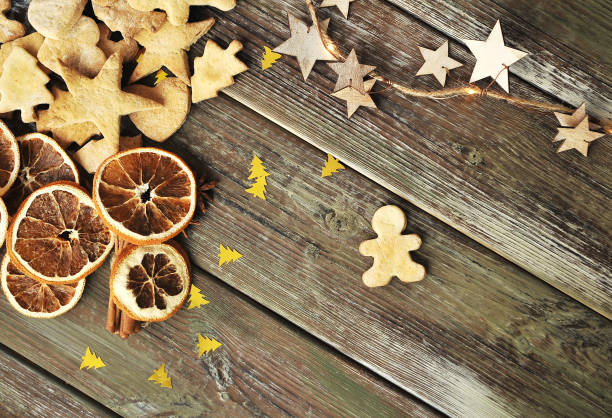 istock Christmas cookies with cinnamon on wooden background. 1284734147