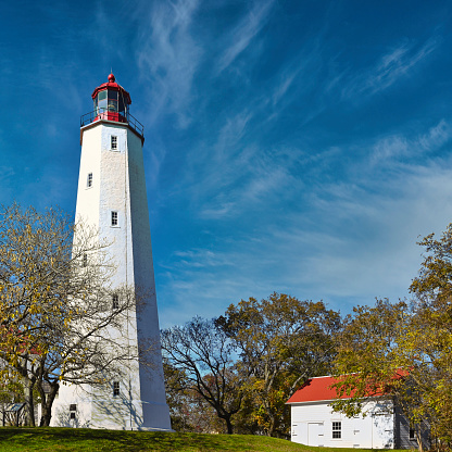 A view of Sandy Hook Lighthouse in Gateway National Recreation Area in Highlands, New Jersey, on a bright autumn day