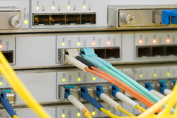 istock Modern cable internet connection. There are high speed central router interfaces in the server room. Fiber optic data transmission wires. 1284738116