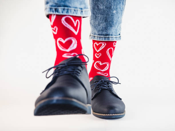 istock Men's legs, trendy shoes and bright socks 1284738213