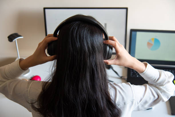 istock Woman working on a white desk at home office 1284738393