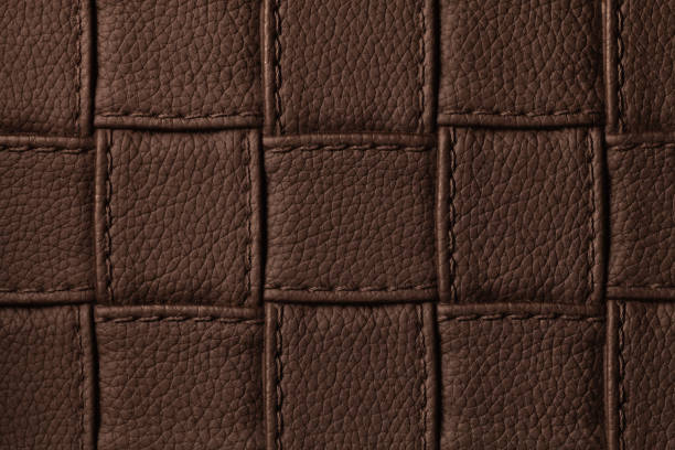 texture of dark brown leather background with square pattern and stitch, macro. - seam macro rough striped imagens e fotografias de stock