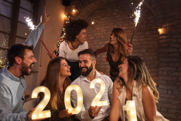 istock Friends having fun at New Year's party midnight countdown 1284742760