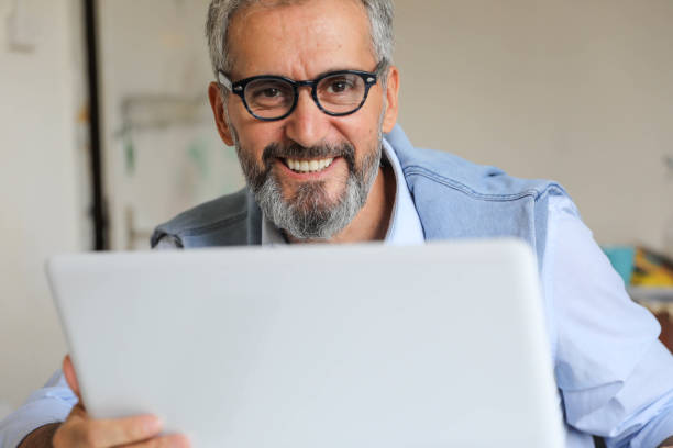 istock Businessman working on laptops at the office 1284743630