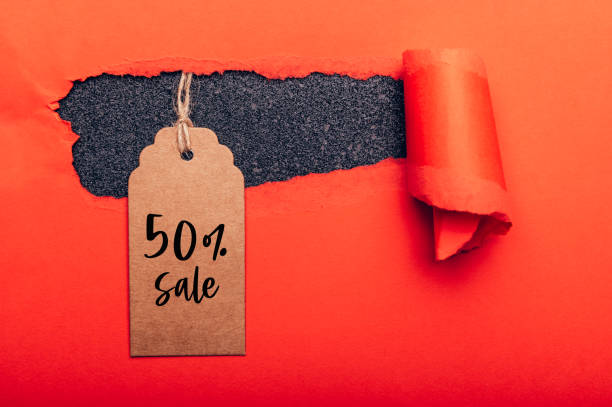 istock Words 50% Sale written on tag 1284744572