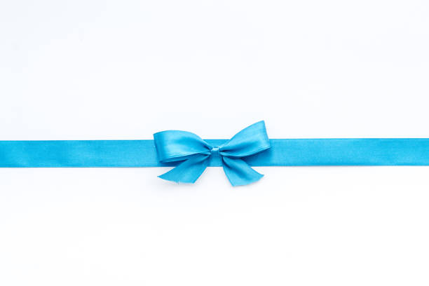 istock Blue ribbon with bow isolated on white for gift box. Top view, copy space 1284744694