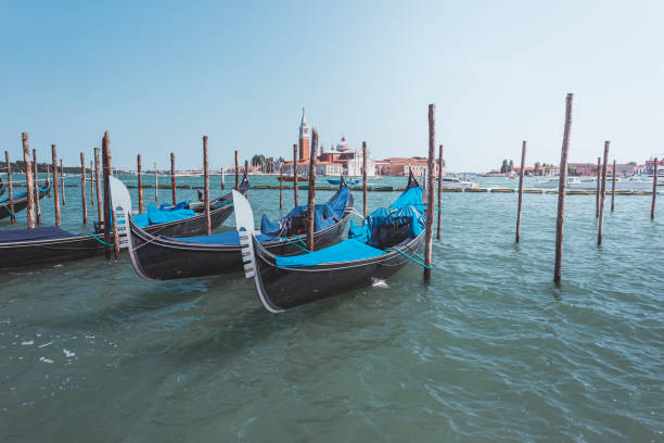 istock Venice, gondolas docked near the shore, Italy 1284745909