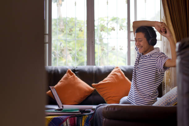 istock Asian people relaxing at home 1284745938