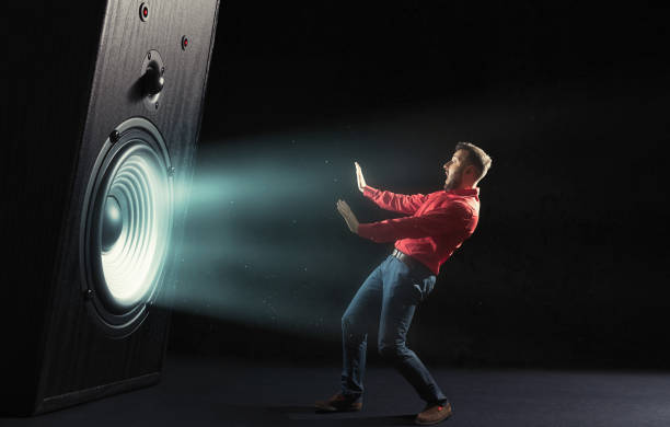 istock Powerful sound wave with funny sound speaker and screaming man. 1284747129