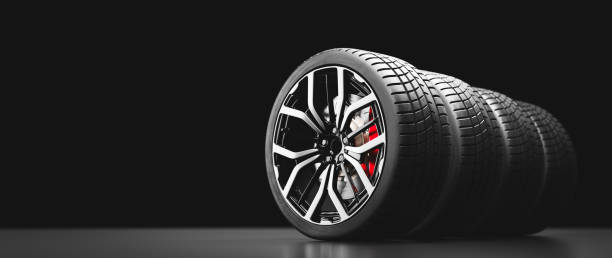 istock Wheels with modern alu rims on black 1284747191
