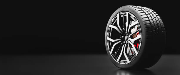 istock Wheel with modern alu rims on black 1284747195