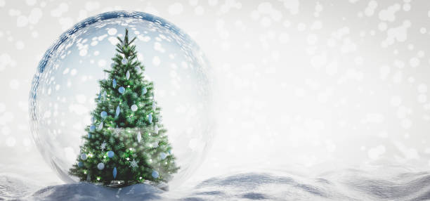 istock Christmas tree in glass ball on snow. 1284747219