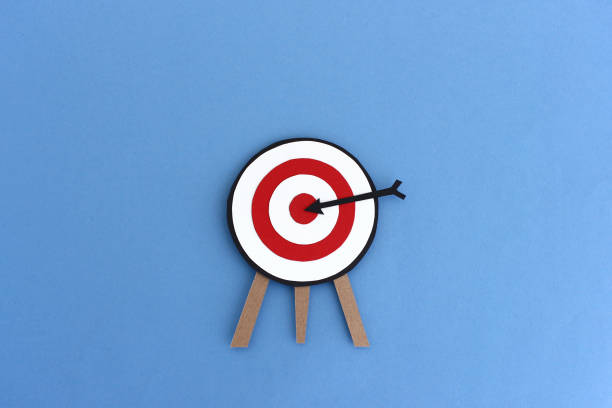 istock Paper target with arrow in center 1284747699