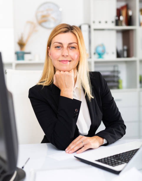 istock Young businesswoman working with laptop and documents 1284752217