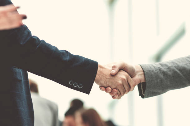 istock close up. business colleagues shaking hands with each other 1284752226