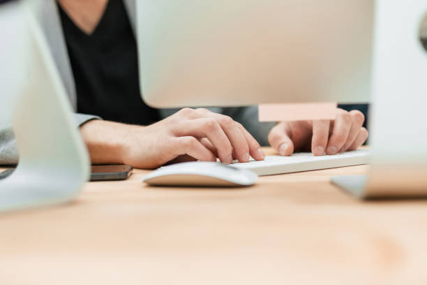 istock close up. business man typing on a computer keyboard 1284752492