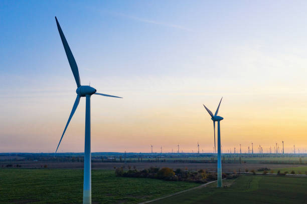 istock wind turbines in sunset landscape 1284753774