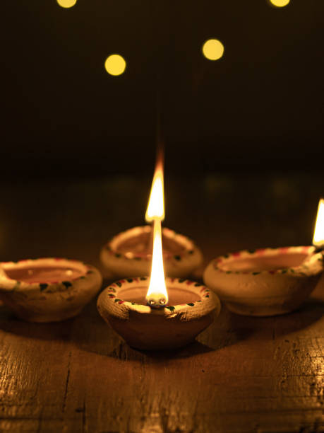 istock Clay Diya  or lamp with rangoli  stock image. 1284753882