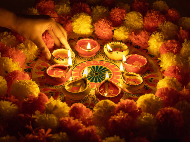 istock Clay Diya  or lamp with rangoli  stock image. 1284753929