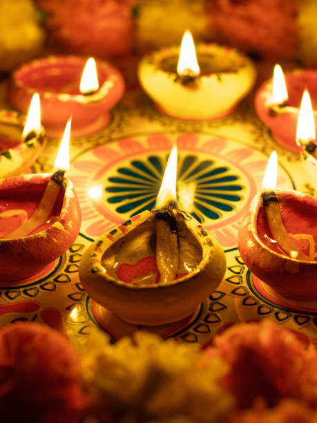 istock Clay Diya  or lamp with rangoli  stock image. 1284754025