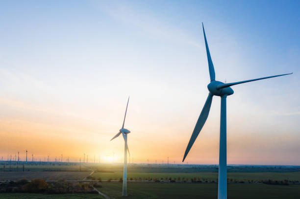 istock wind turbines in sunset landscape 1284754110