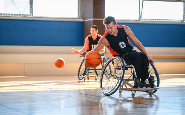 istock Wheelchair Basketball Player Dribbling During Practice 1284754277