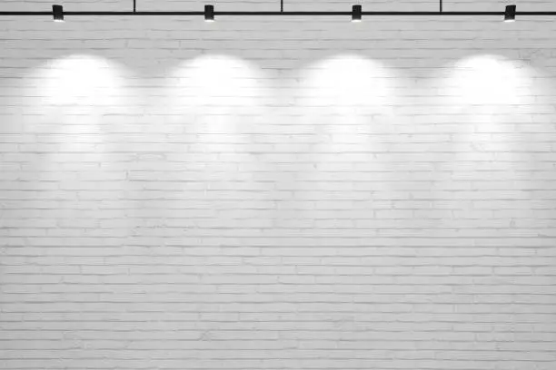 Photo of White old brick wall background with lamps
