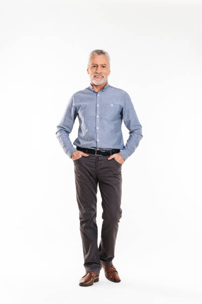 istock Positive old man looking camera and smiling over white 1284755093