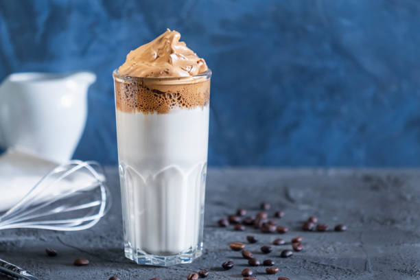 istock On a blue background dalgon coffee close-up. Delicious popular drink. Photo with place for text 1284755884