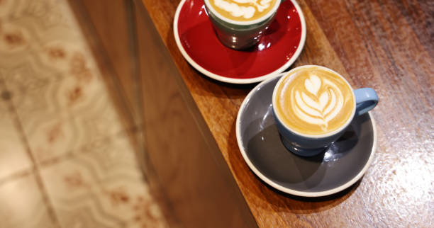 istock Latte art on old wooden table 1284755949