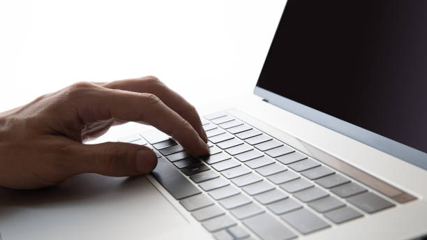 istock close up. man typing on a laptop keyboard 1284757943