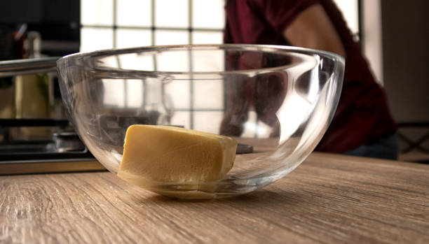 butter in a glass transparent bowl for kneading dough - chef cookie dishware domestic kitchen imagens e fotografias de stock