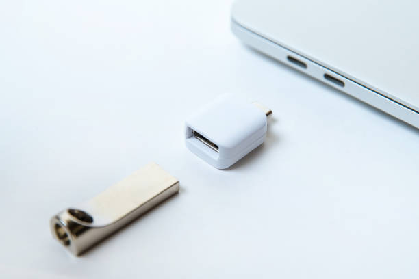 istock close up. laptop and open flash card on a white background. type-c 1284758714