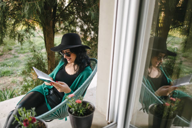 istock A Middle-aged woman reading a book 1284758759