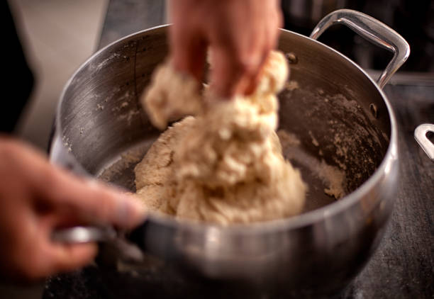 the step of adding salt, baking powder and vanilla . dough preparation process. - chef cookie dishware domestic kitchen imagens e fotografias de stock