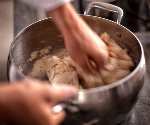 the step of adding salt, baking powder and vanilla . dough preparation process. - chef cookie dishware domestic kitchen imagens e fotografias de stock