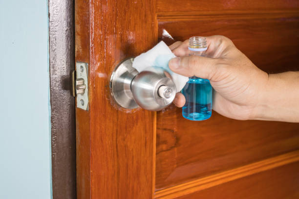 istock Prevention cleaning Door handles by Disinfectant solution for killing corona virus on touching surfaces, concept coronavirus COVID19 1284759194