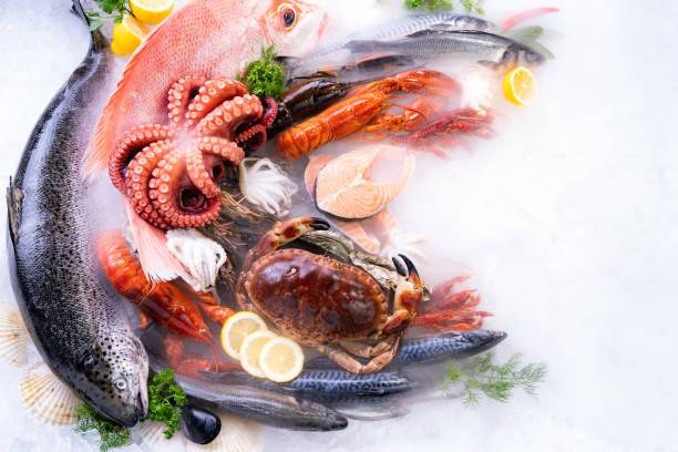 istock Top view fresh seafood on ice background with copyspae 1284760377
