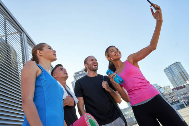 istock Happy young multiracial sportive people taking selfie 1284760489