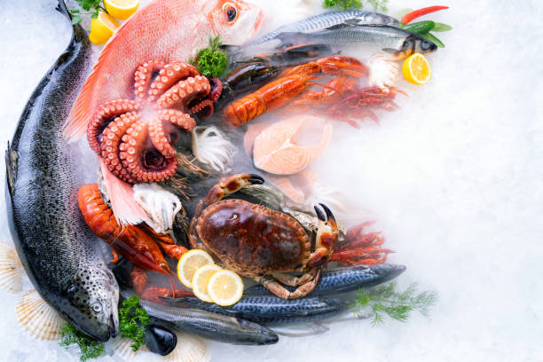 istock Top view fresh seafood on ice background with copyspae 1284760582
